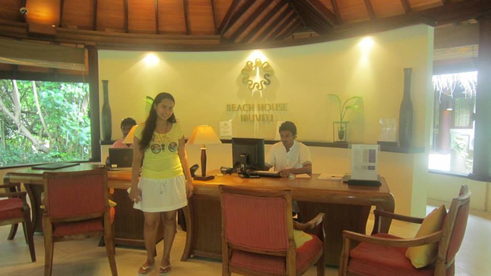Meliza at a Maldives resort front desk area