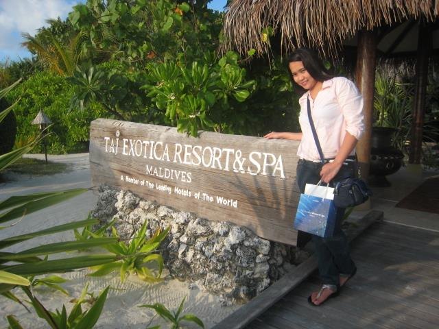 Meliza beside Taj Exotica Resort and Spa Maldives signage